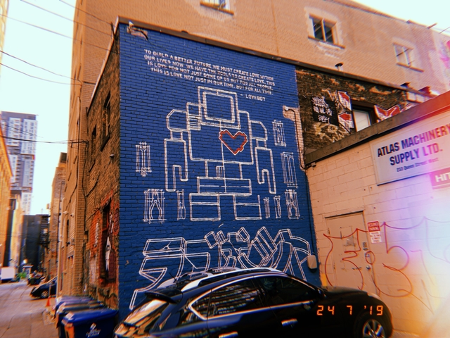 Graffiti on the side of a build.